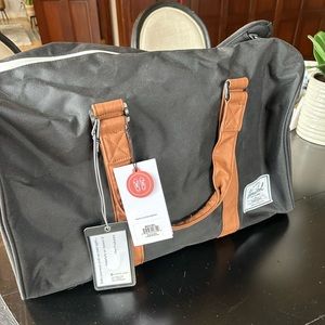 Herschel NWT hard to find duffle in black and tan